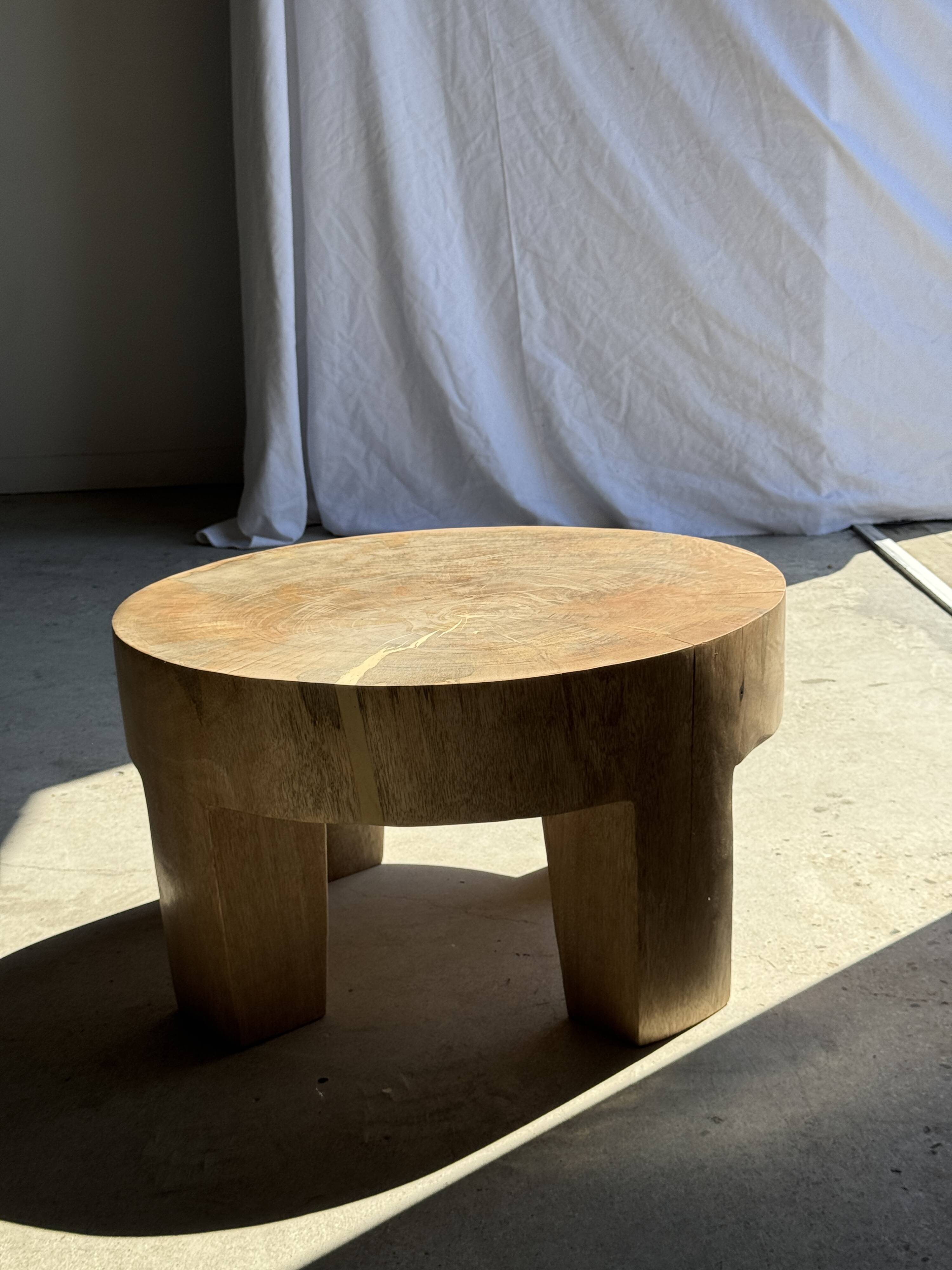 Coffee table, four-legged low table in natural solid monoxyle mango wood.