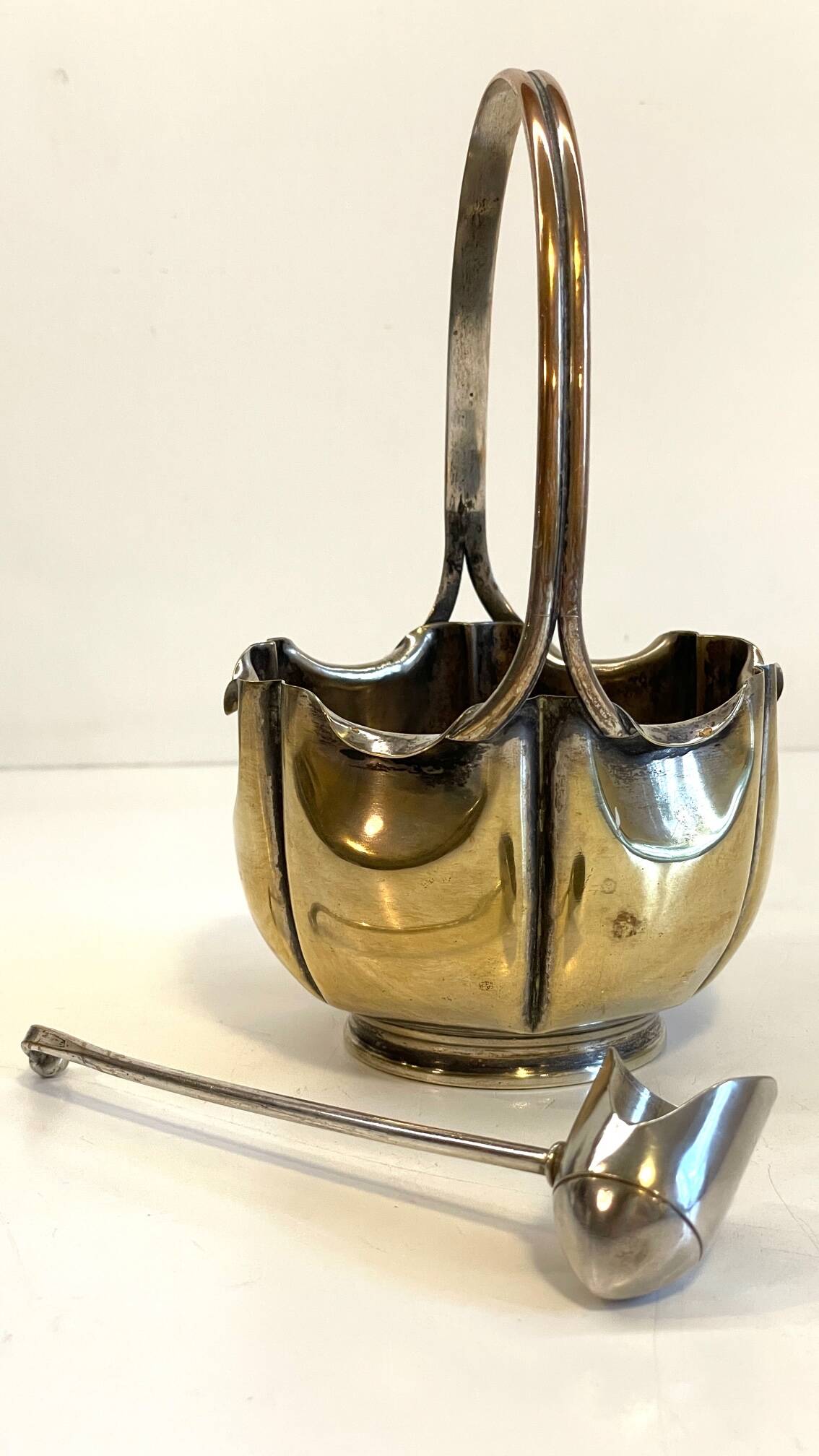 silver metal sugar bowl with gold patina