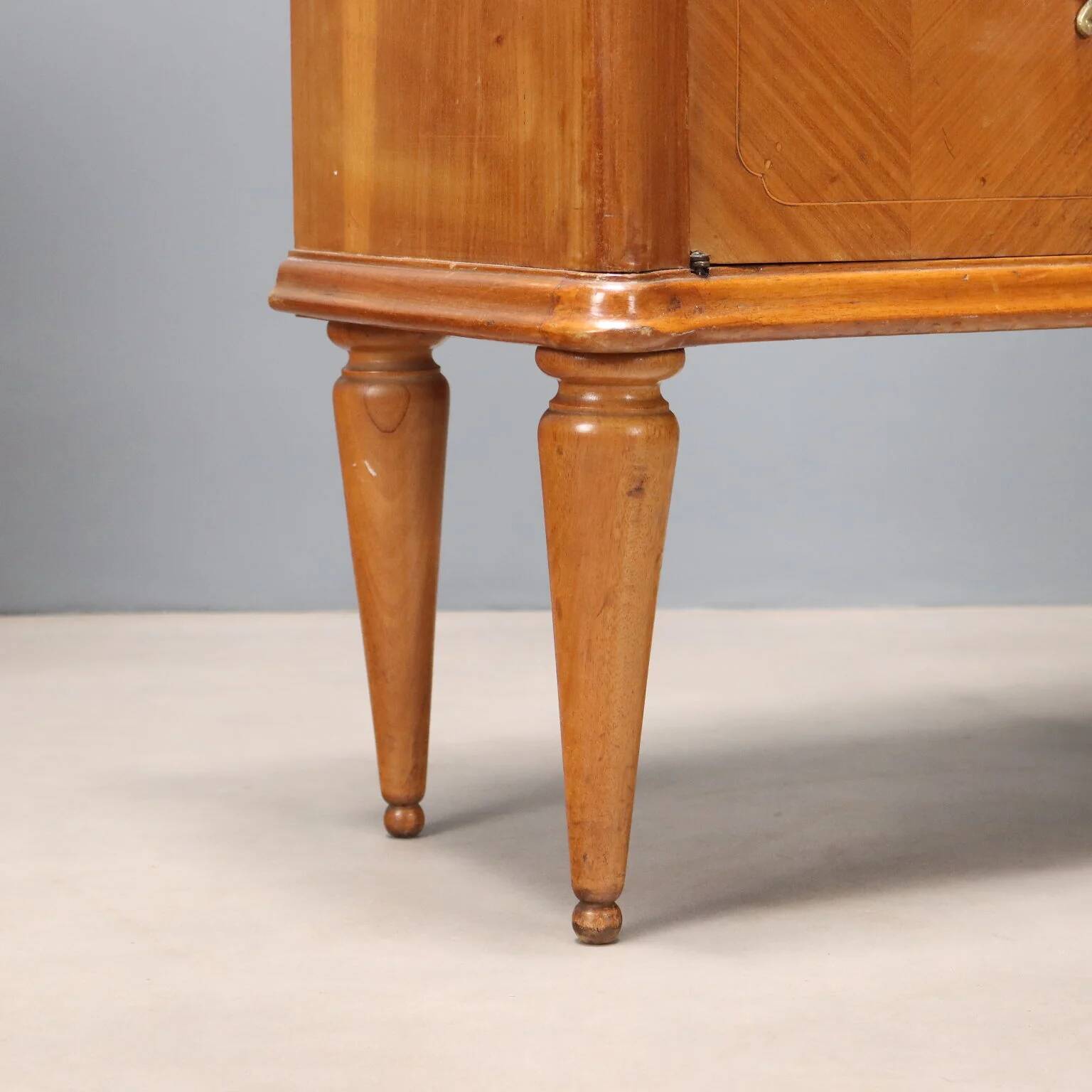 Pair of wooden and glass bedside tables from the 1950s.