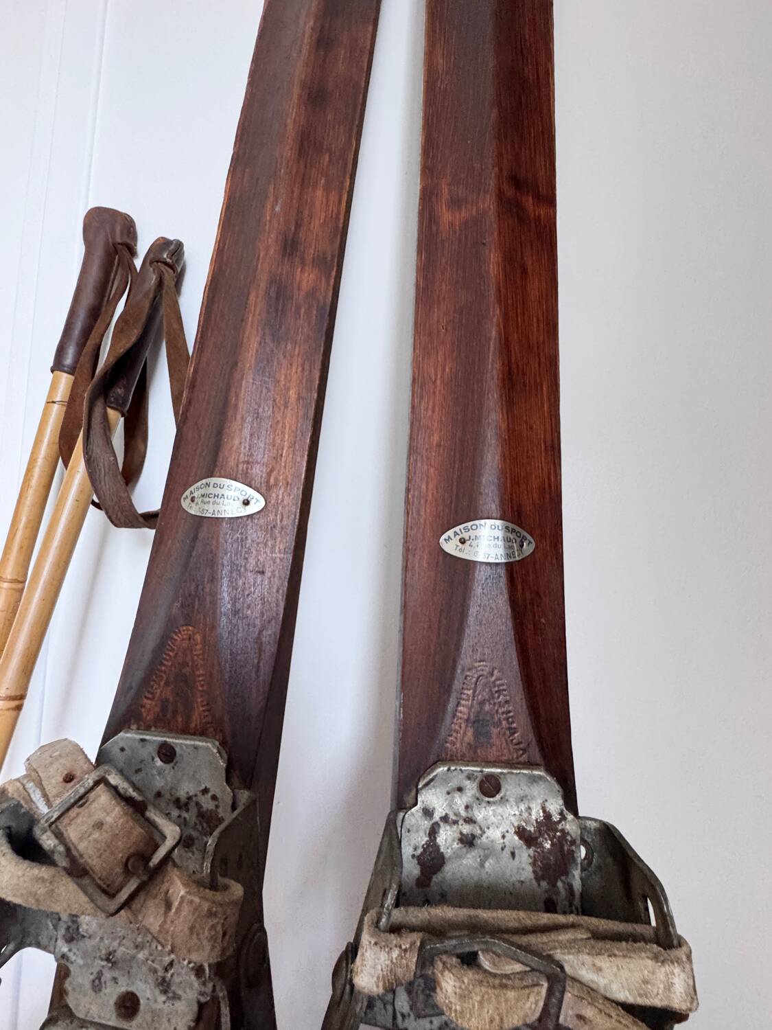 Antique wooden skis with vintage poles