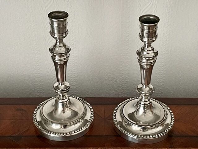 Pair of Christofle silver metal candle holders.