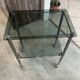 Serving dessert trolley with 2 smoked glass shelves and metal structure.