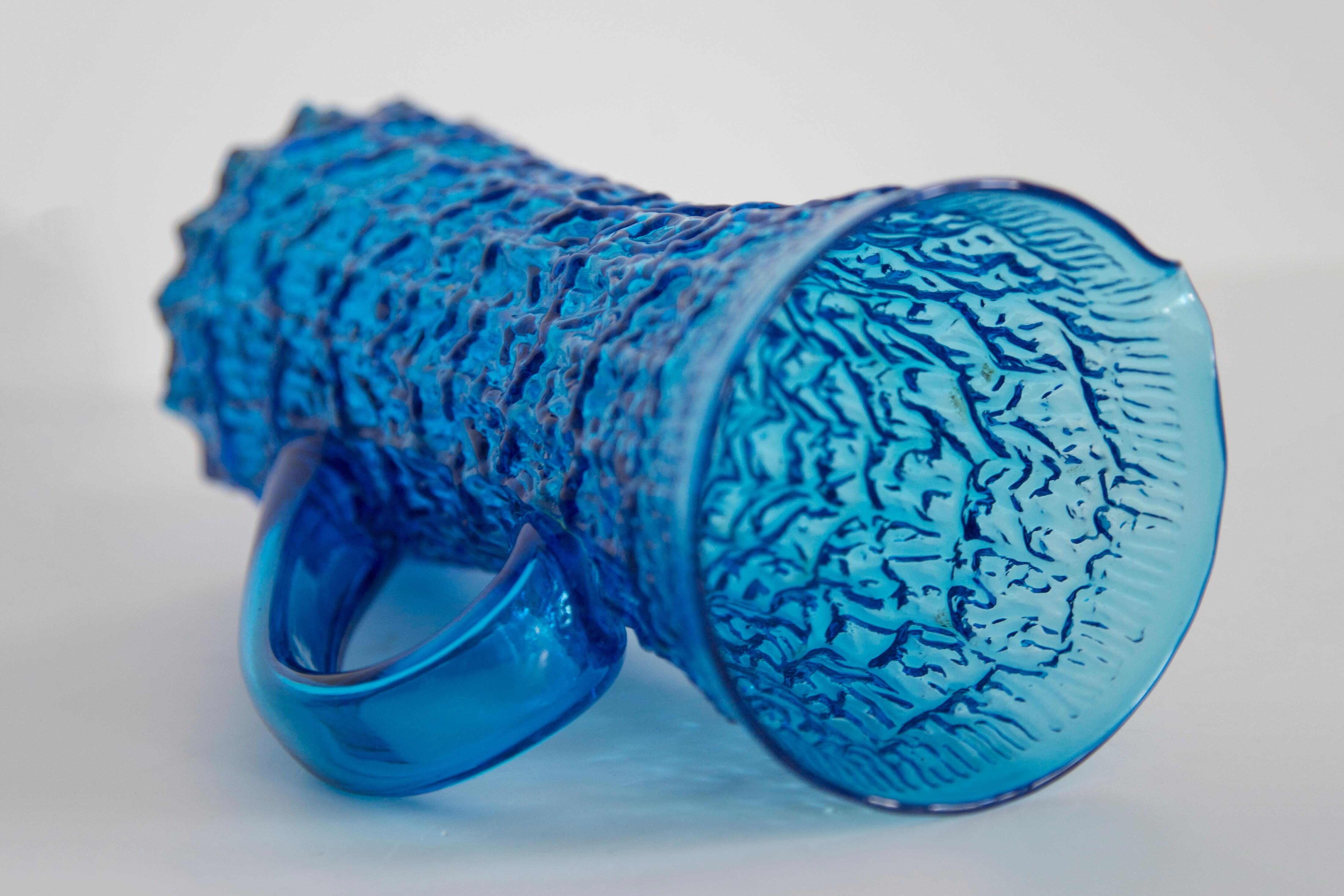 Blue glass water or juice pitcher from the mid-20th century.