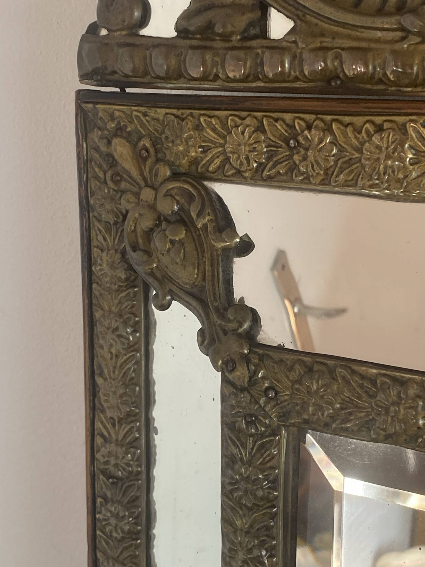 Mirror with brass repoussé frame