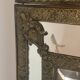 Mirror with brass repoussé frame