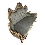 A soft light blue and silver tufted beech wood sofa in Louis style.