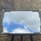 Vintage rectangular wall mirror in tubular metal and brass, 1970s/1980s.