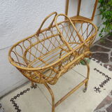 Rattan bassinet on folding support