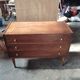 Vintage commode with tapered legs.