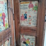 Wooden screen with vintage haute couture images or for photos