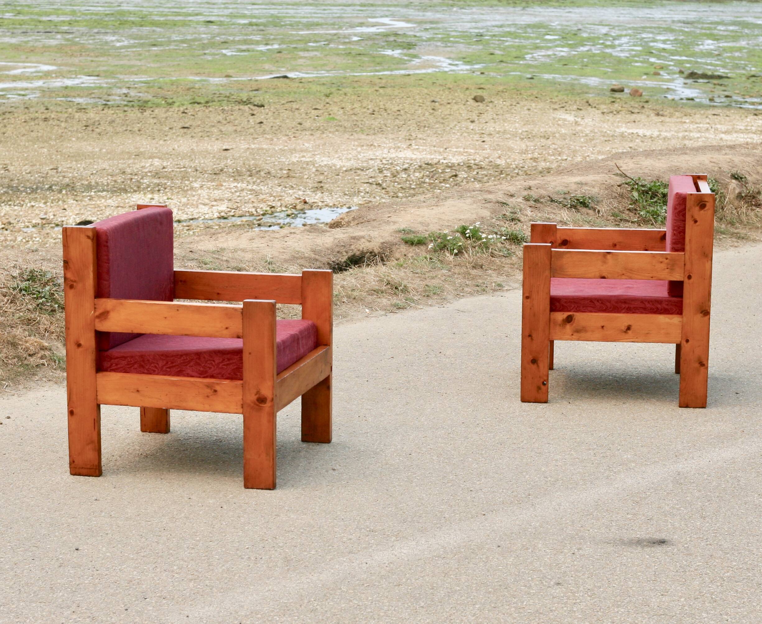 Pair of pine fireside chairs, France, 1960s, "raspberry" cushions