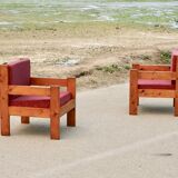 Pair of pine fireside chairs, France, 1960s, "raspberry" cushions