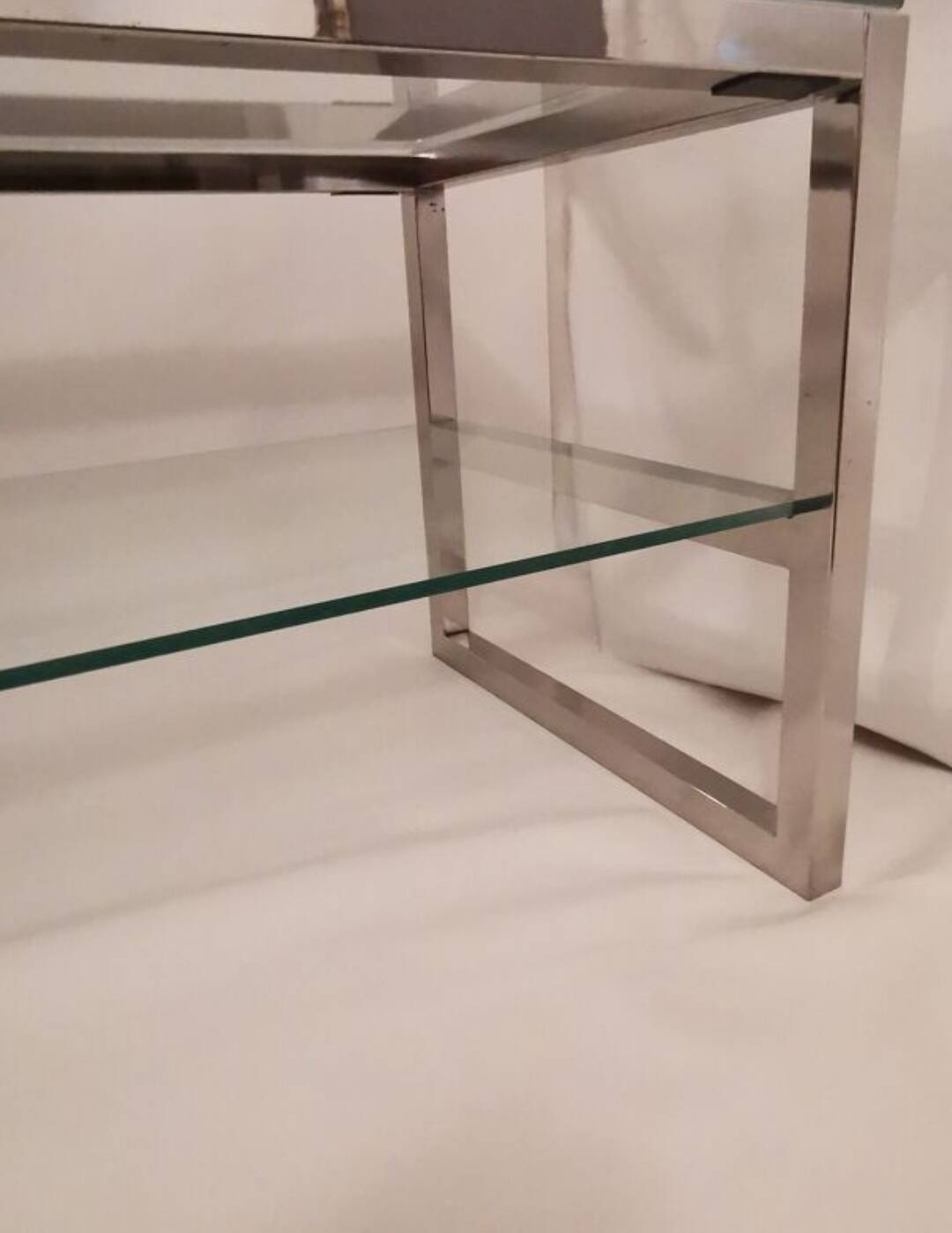 1980s coffee table with a double chrome metal top.