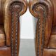 Set of 2 subtle, stately and sturdy club chairs made of sheepskin