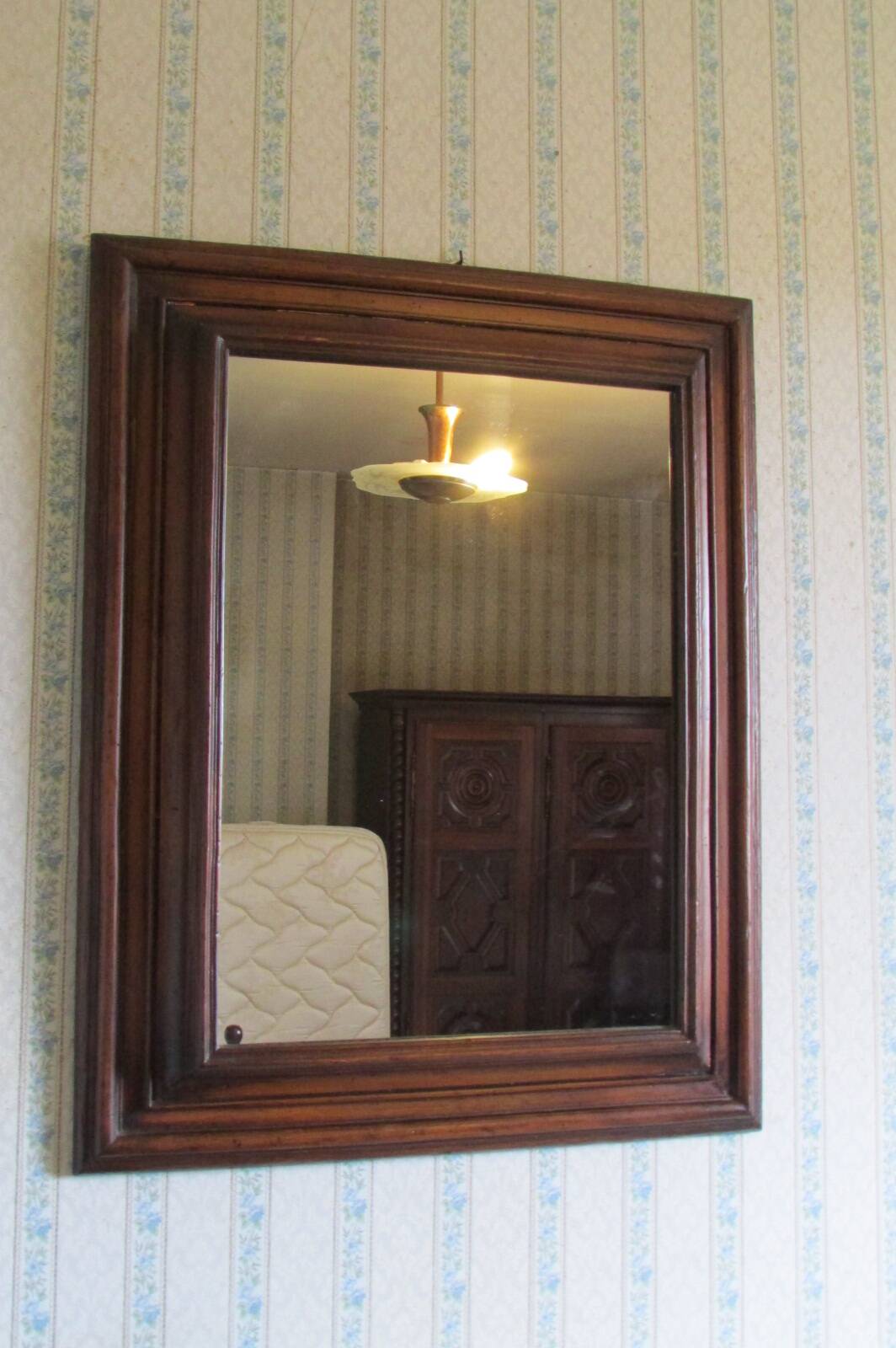 Large mirror in natural stained wood