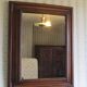 Large mirror in natural stained wood