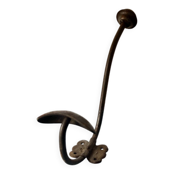 Antique coat rack with red wooden ball