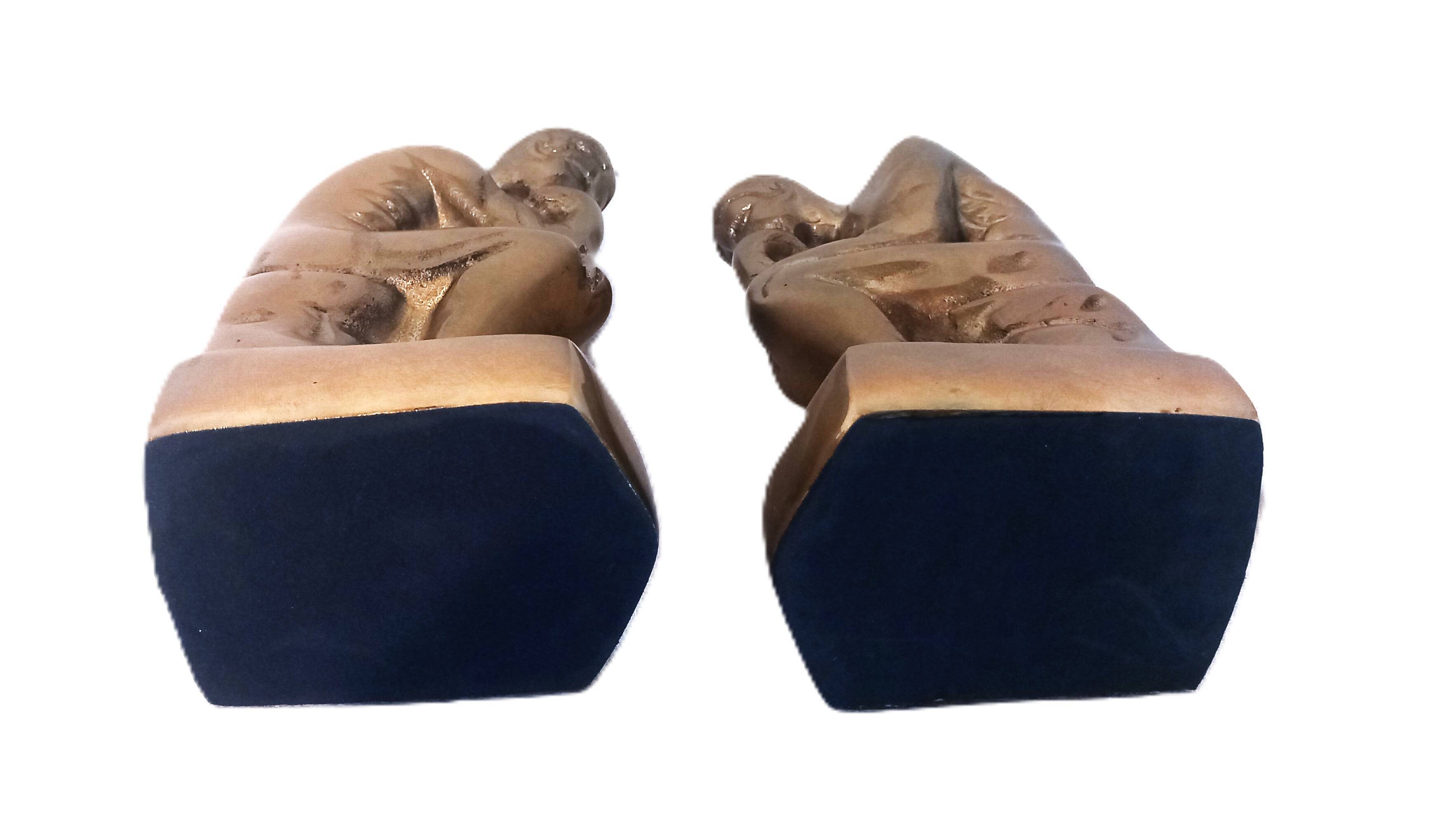 Pair of brass "thinker" bookends