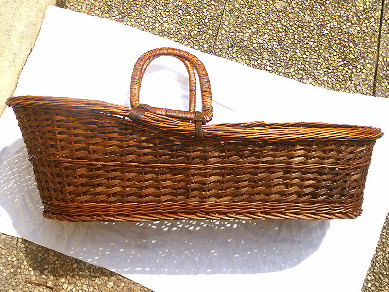 Old braided wicker couffin