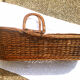 Old braided wicker couffin