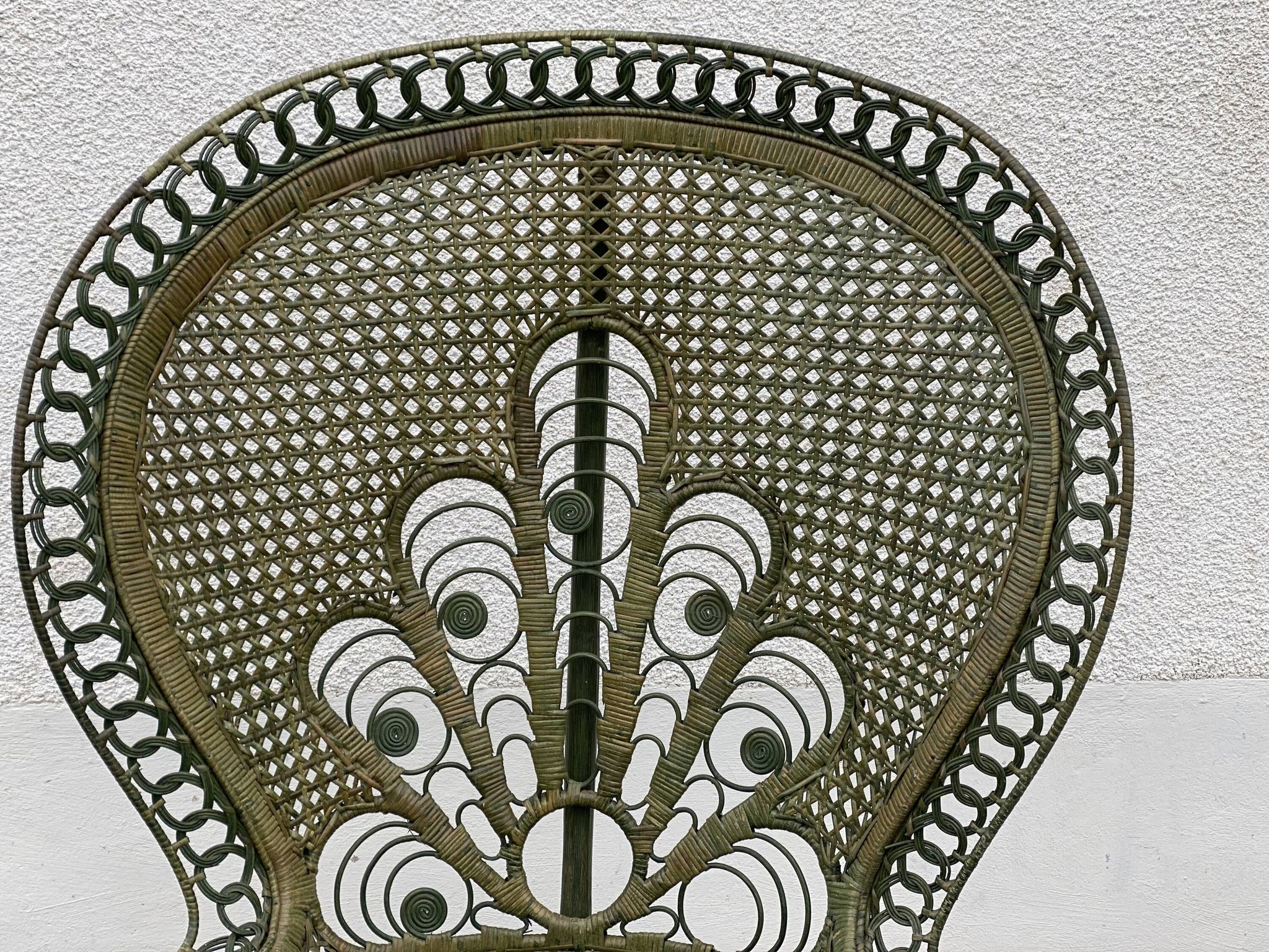 Vintage 1970s green patinated peacock rattan armchair