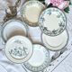 Old mismatched flat plates made of ironstone earthenware.