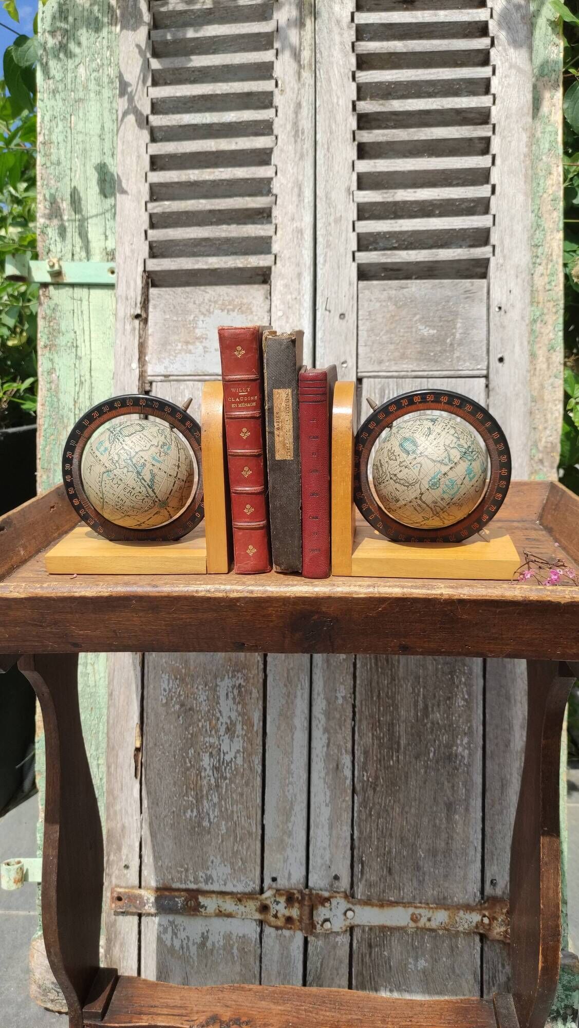 Pair of greenhouses vintage wooden books world map