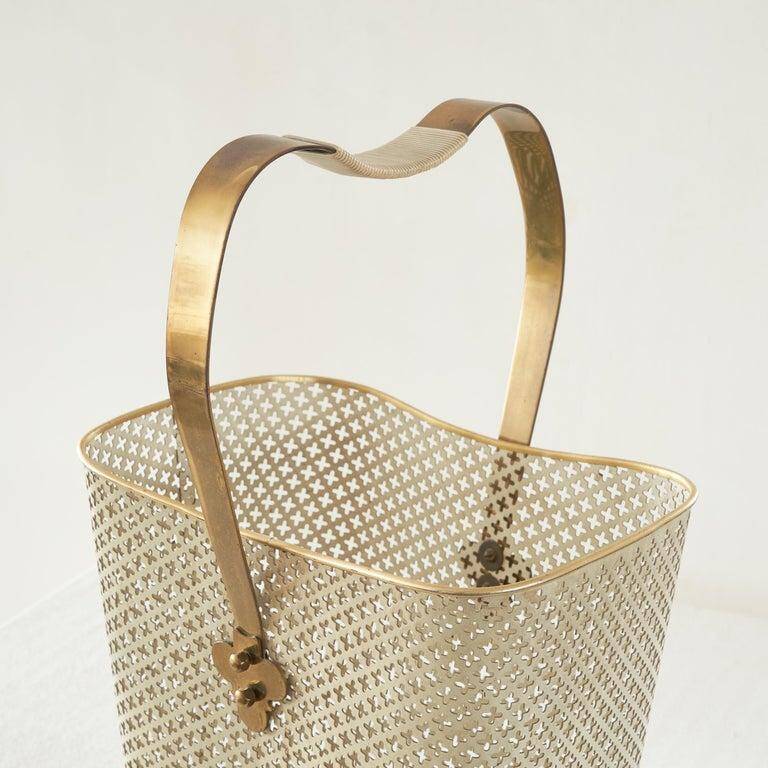 Mid-century umbrella stand in patinated brass and perforated metal, 1950s.