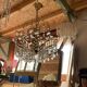 Mid-century chandelier and 2 wall sconces in gilded brass and clear glass, 1960s.