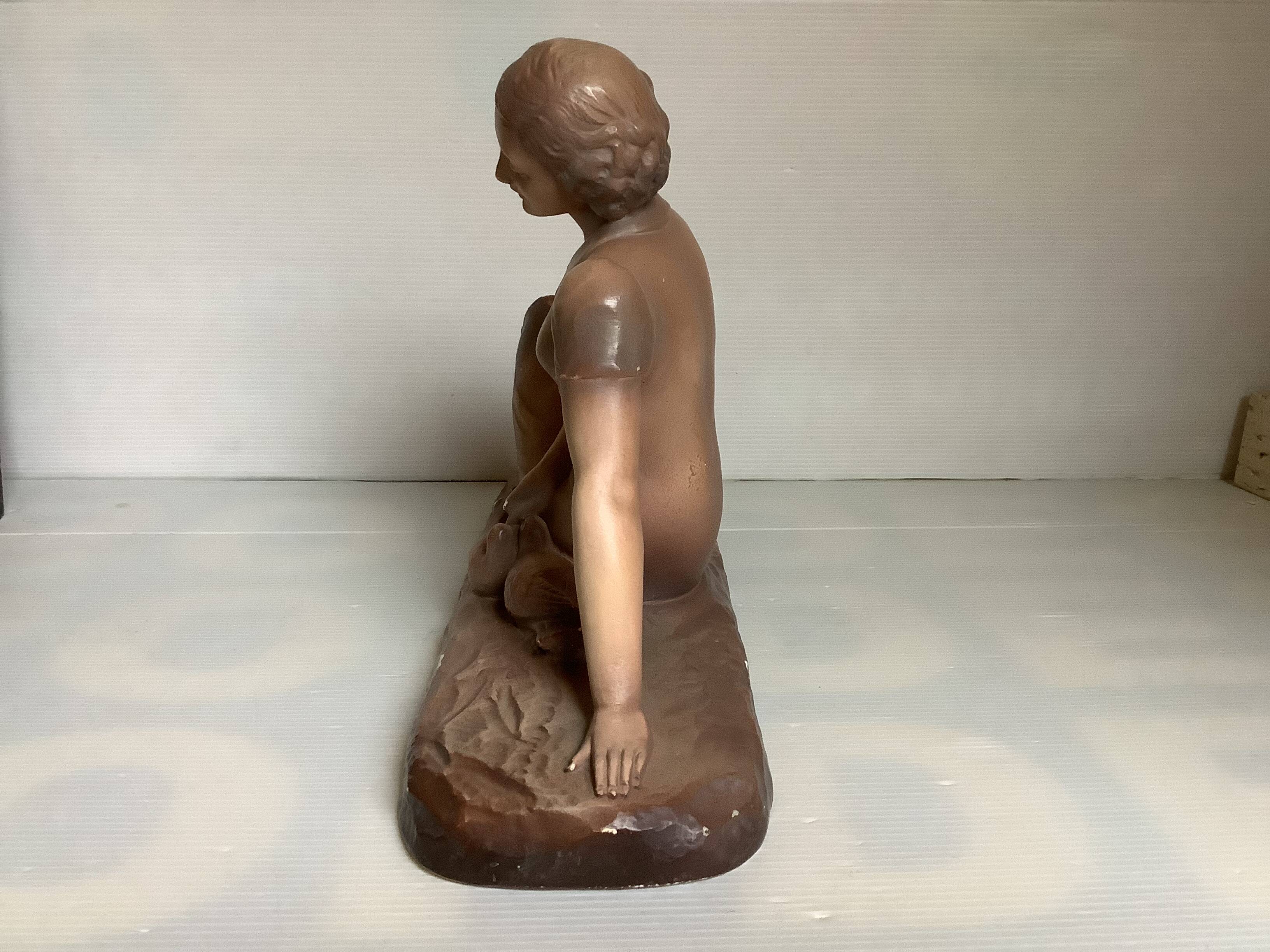 Art Deco statue of the woman with birds