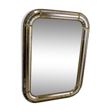 Faceted mirror and gold brass pare closes