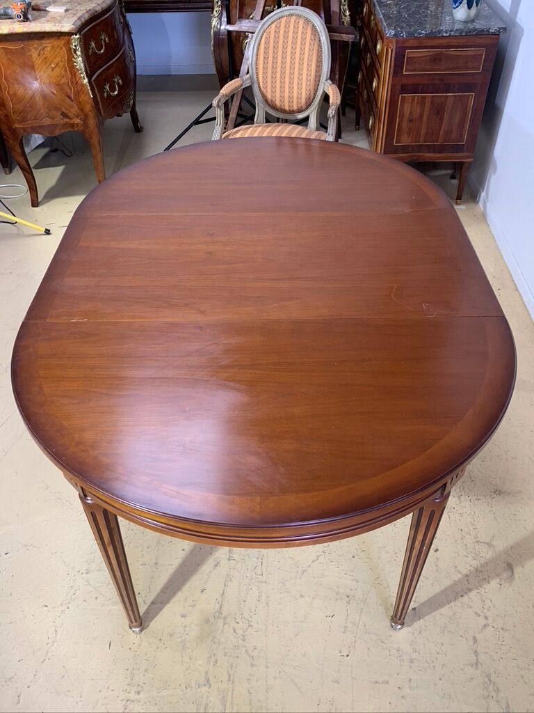 Louis XVl style round table in cherry with extensions