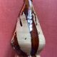 Large antique pottery bottle in glazed terracotta with drips.