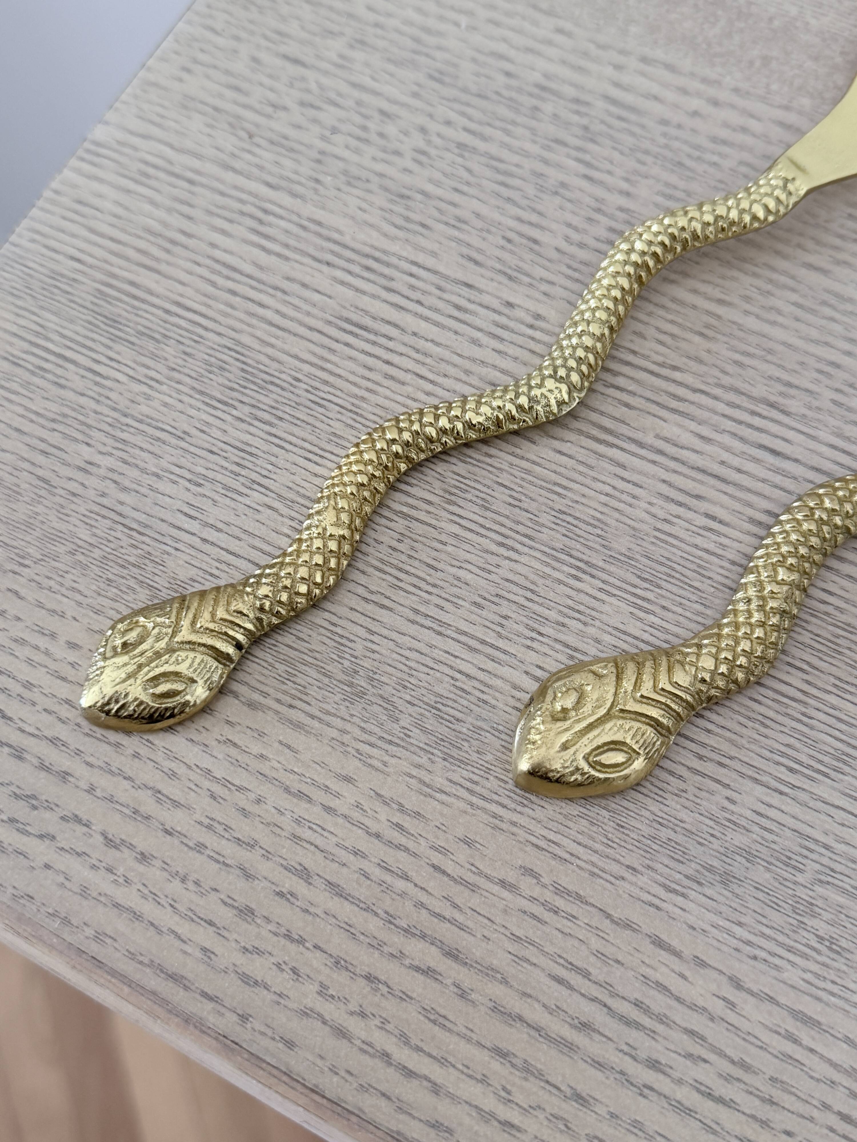 Gold metal snake salad serving set