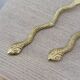 Gold metal snake salad serving set