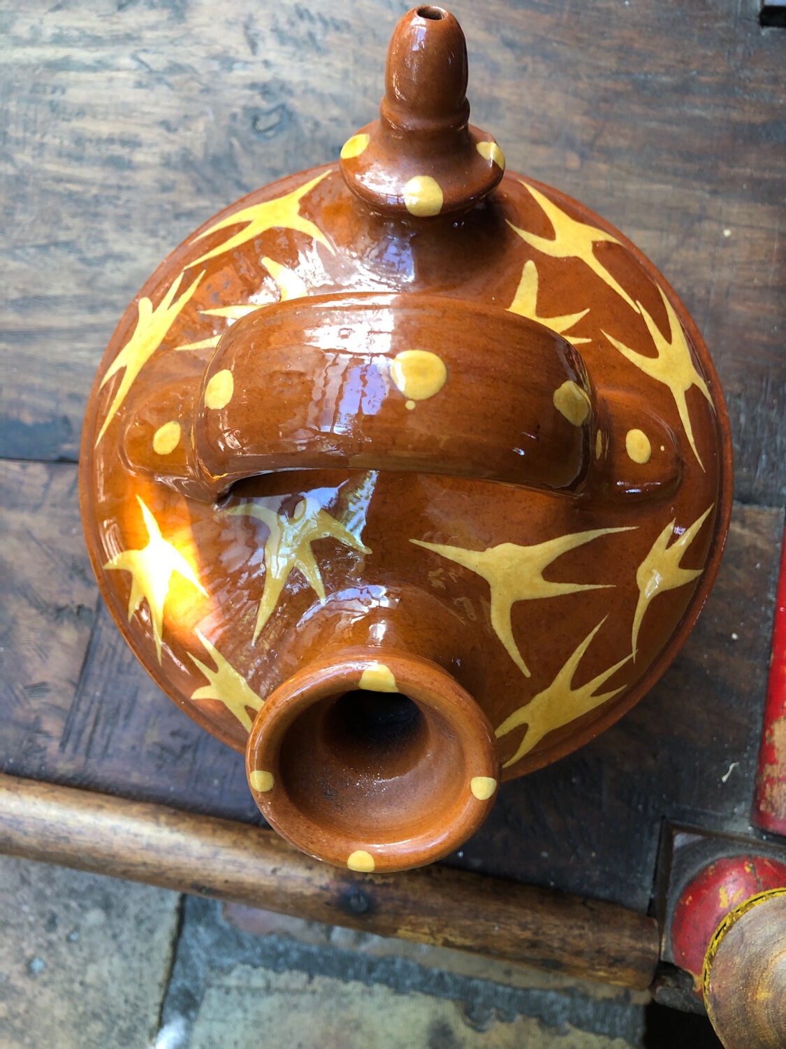Orange glazed terracotta gargoulette