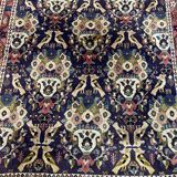 Antique Oriental rug from a nomadic tribe, 1950-1980, birds on a purple background