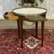 Louis XVI style bouillotte table in mahogany with a white marble top.