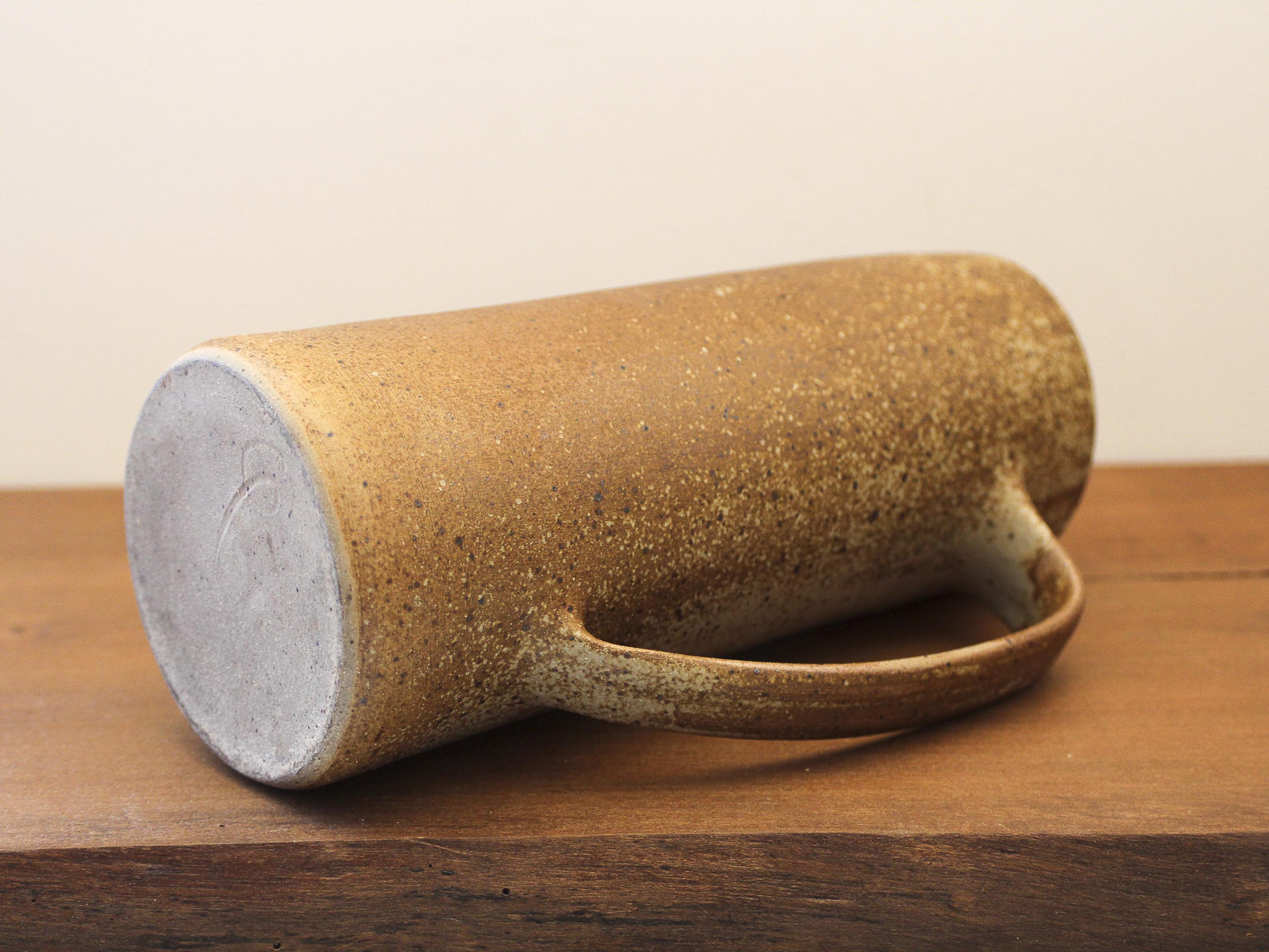 Pitcher in sandstone pyrity signed