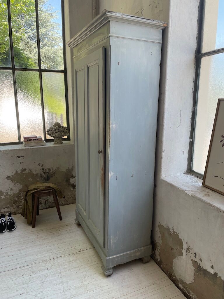 Blue patinated cap cabinet