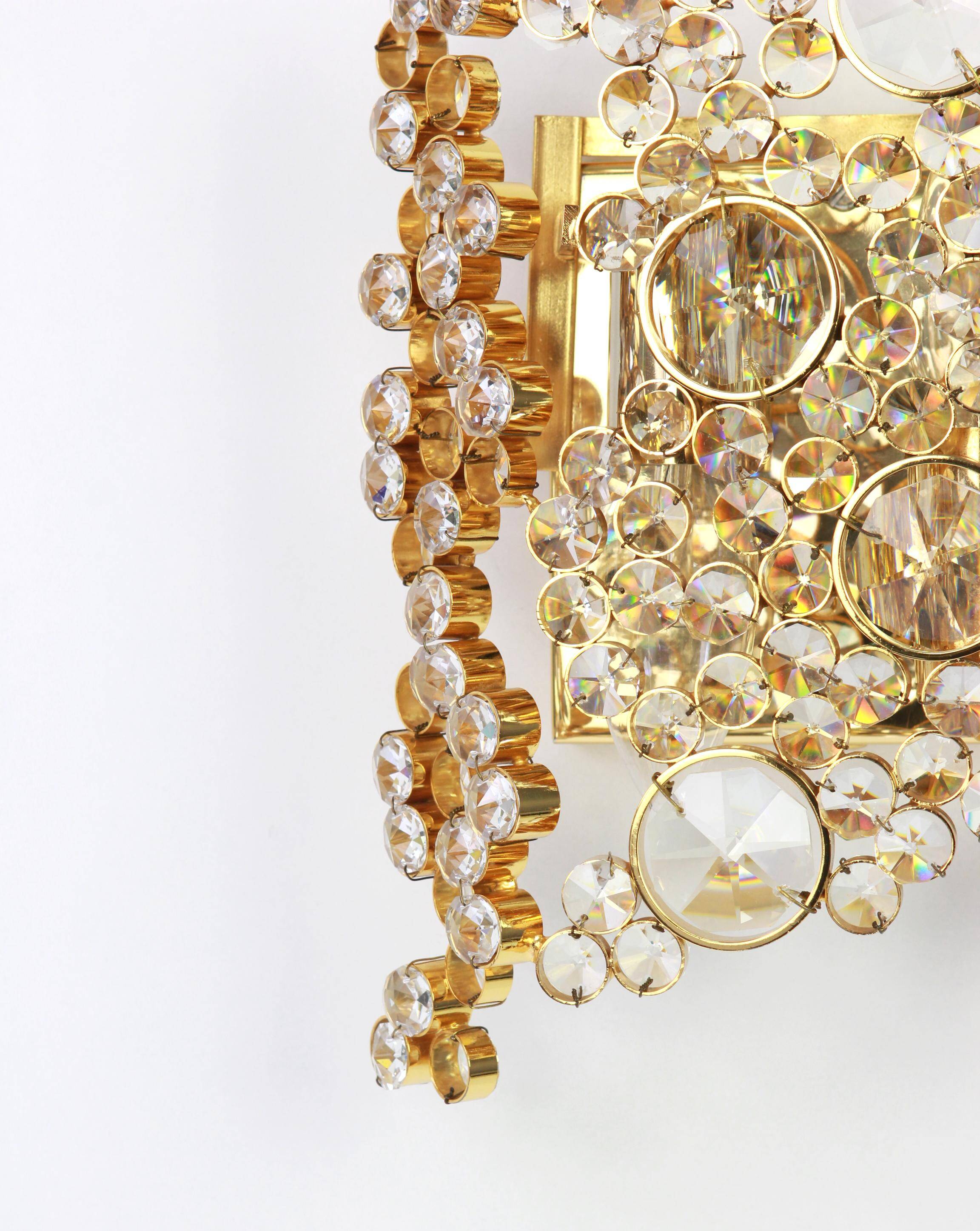 Pair of wall sconces in gilded brass and crystal by Palwa, Germany, 1960s.