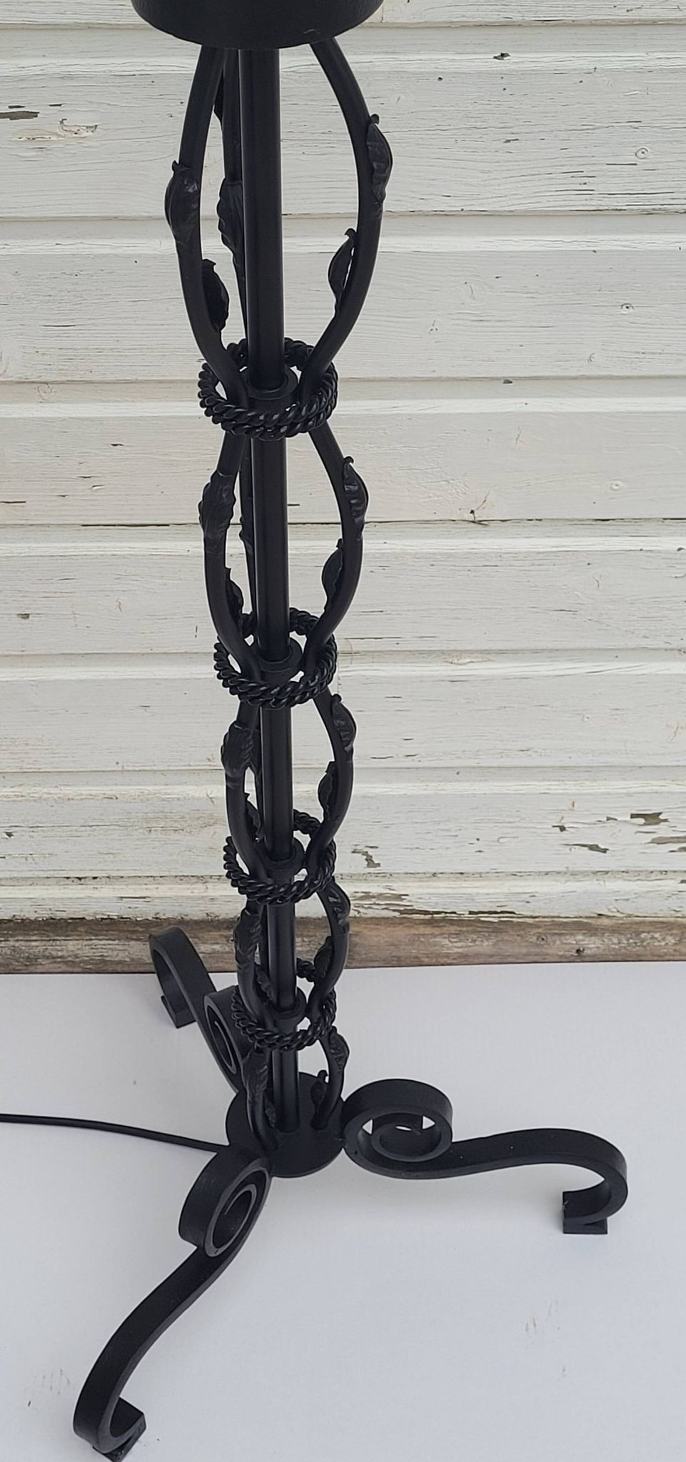 Black wrought iron floor lamp attributed to Gilbert Poillerat