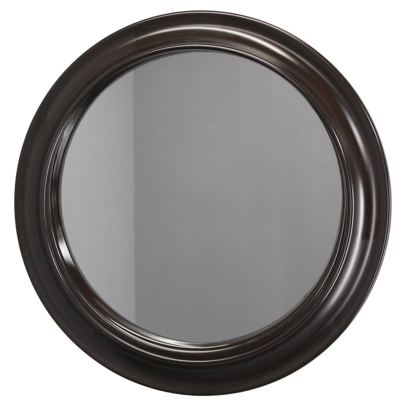 1970s Italian round mirror in dark brown plastic frame