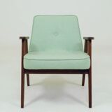 Pastel pistachio wool fabric Scandinavian armchair, oak wood.
