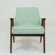 Pastel pistachio wool fabric Scandinavian armchair, oak wood.