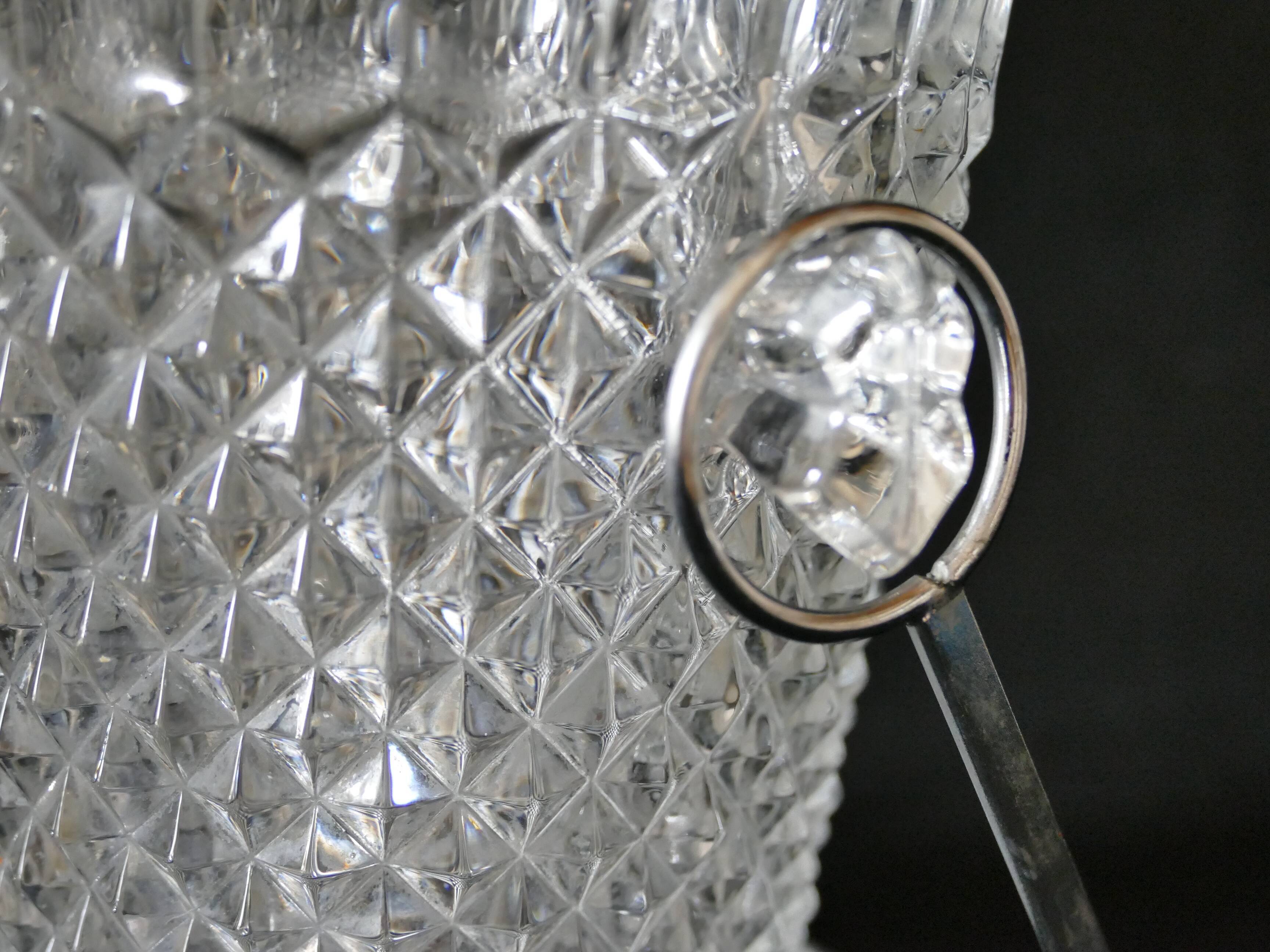 Vintage glass ice bucket stamped with a metal handle