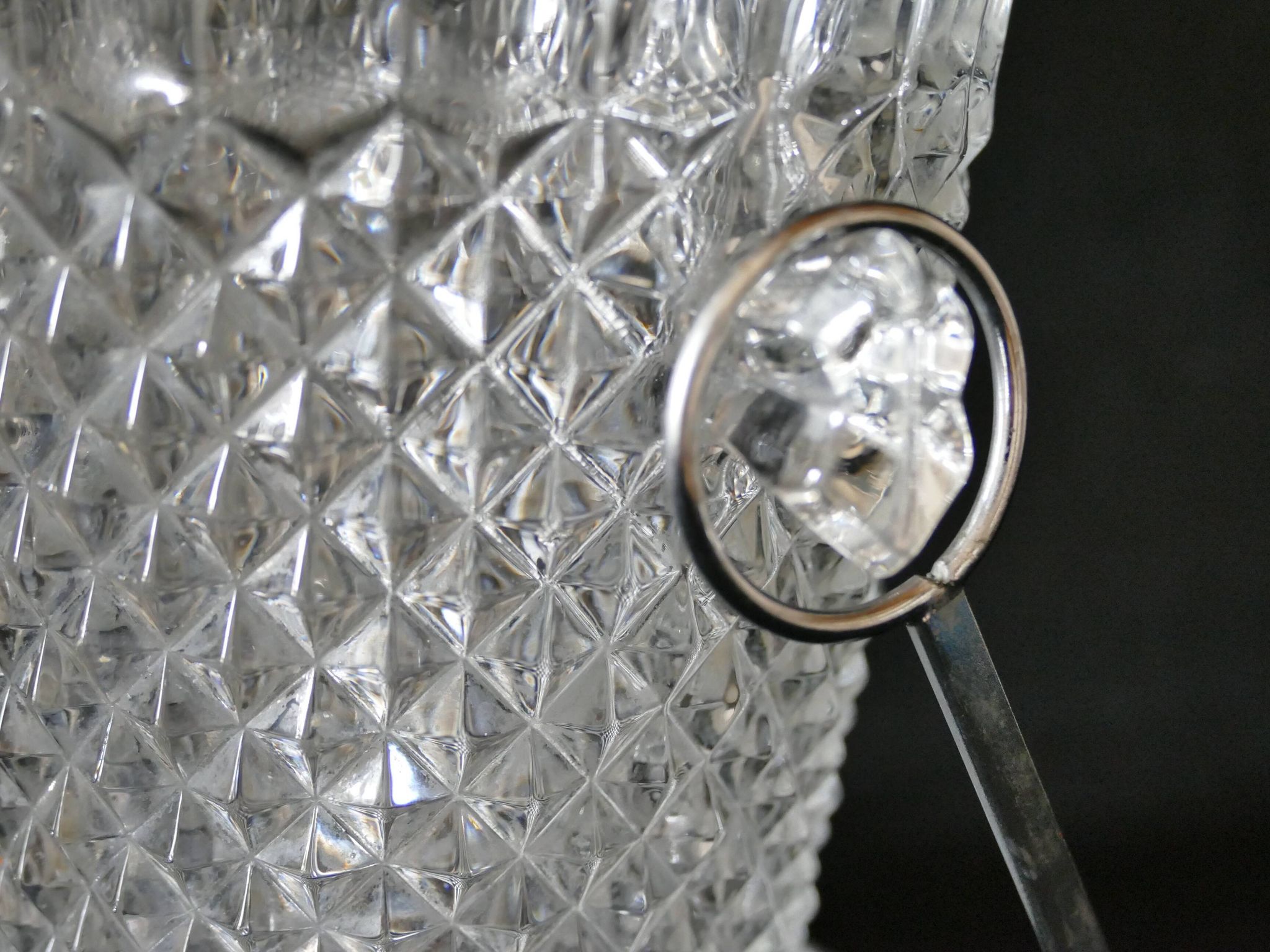 Vintage glass ice bucket stamped with a metal handle