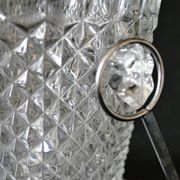 Vintage glass ice bucket stamped with a metal handle
