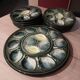 2 dishes and 12 oyster plates