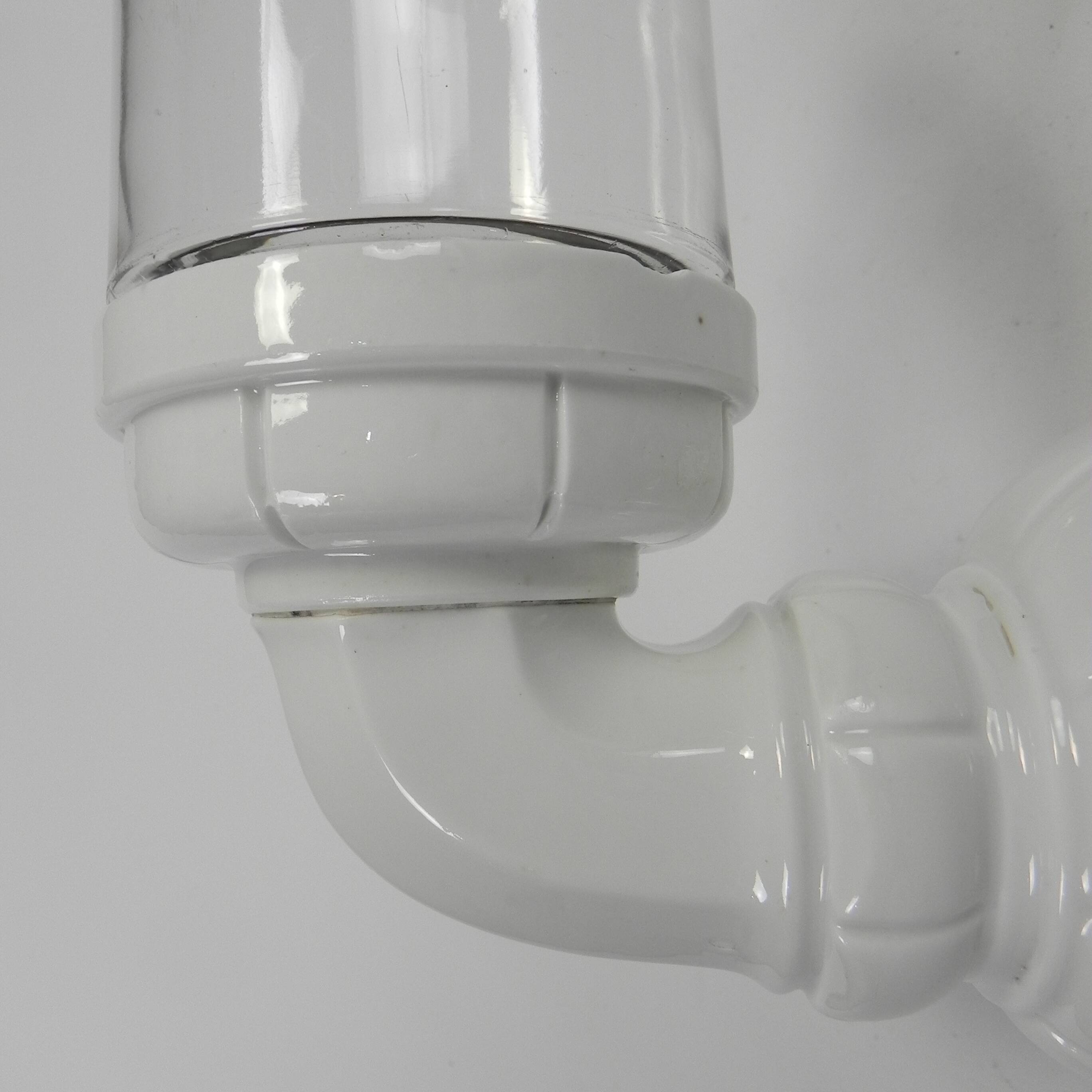 Wall lamp in porcelain with a transparent glass shade, 1930s.